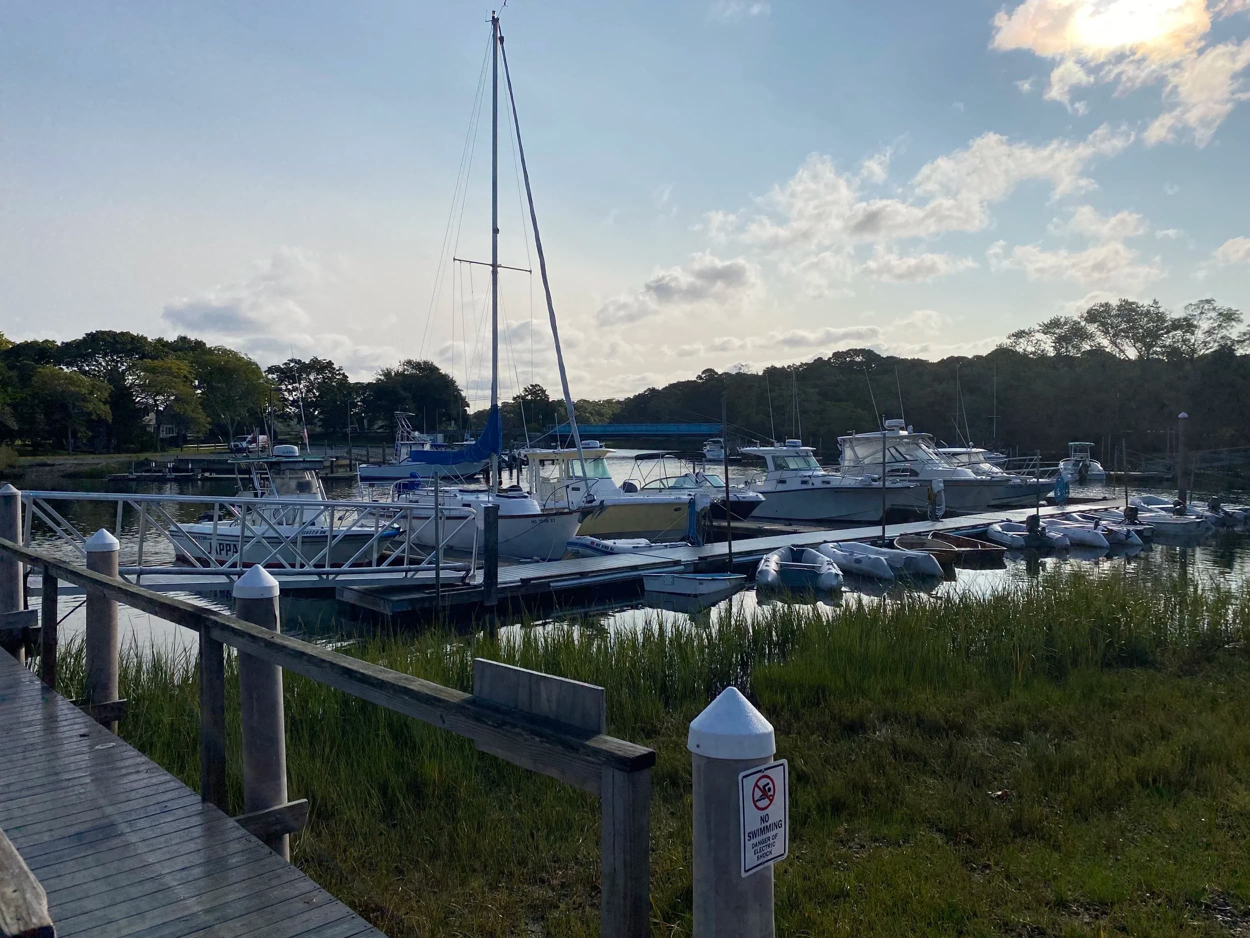 Evening light over sailboats and floating docks at Scallop Bay Marina