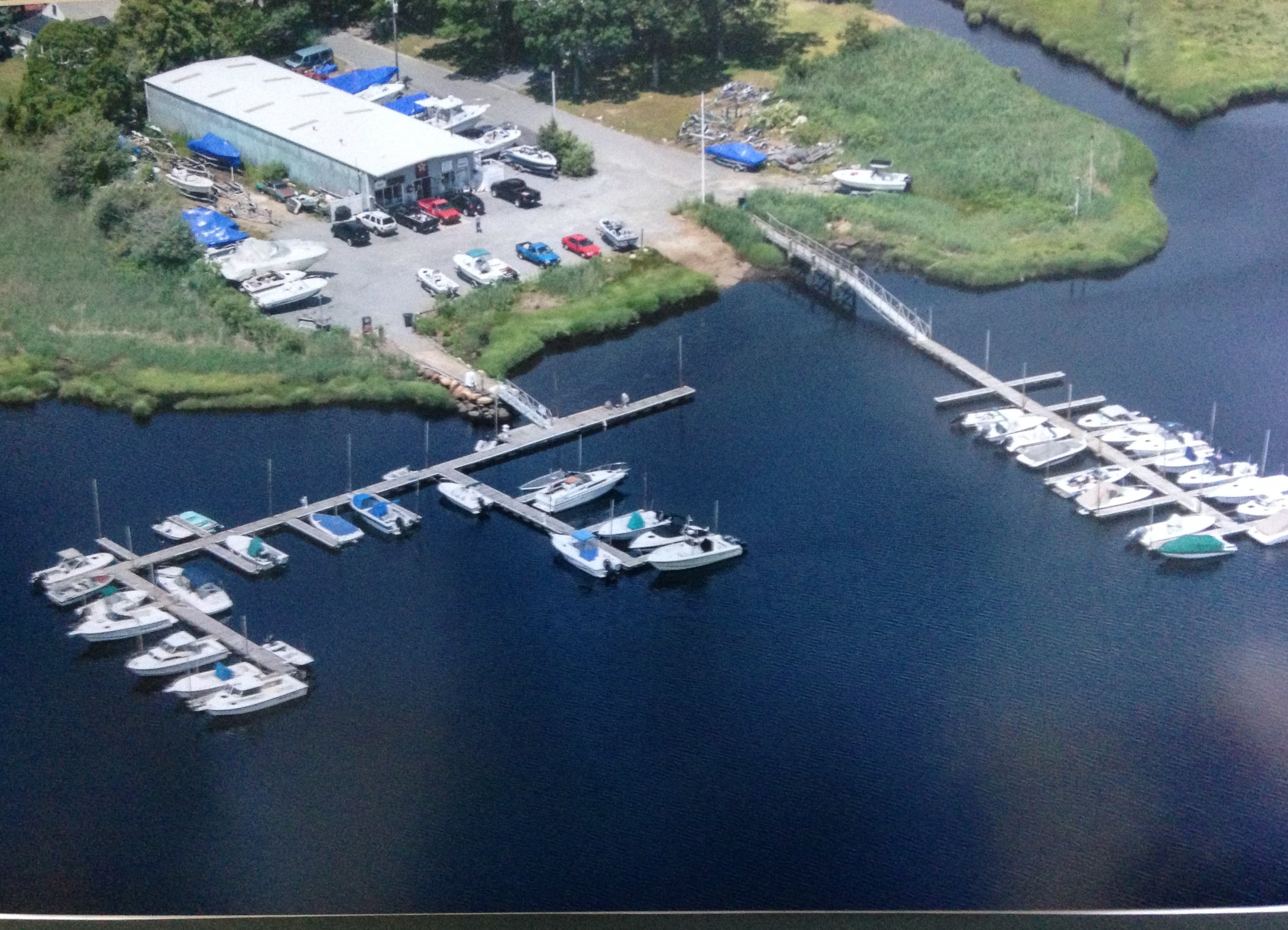 Aerial view of Wareham Marina's docks, yard and buildings on the Weweantic River